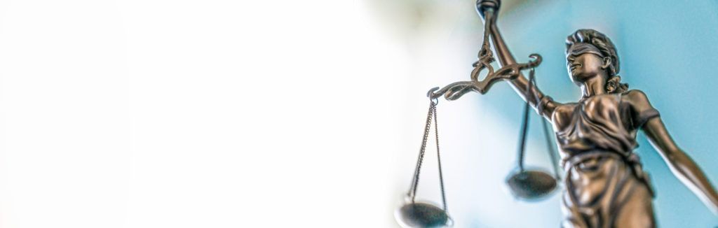 Statue of lady justice on bright background Side view with cop