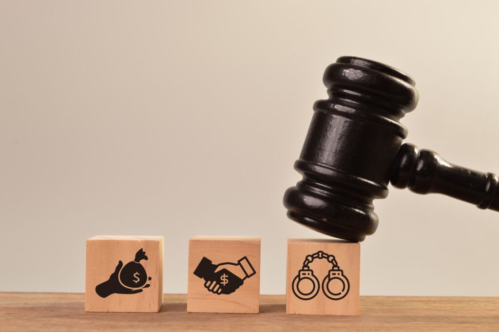 Judge’s gavel striking legal blocks symbolizing prosecution standards and reasonable prospect of conviction in Canadian criminal law.