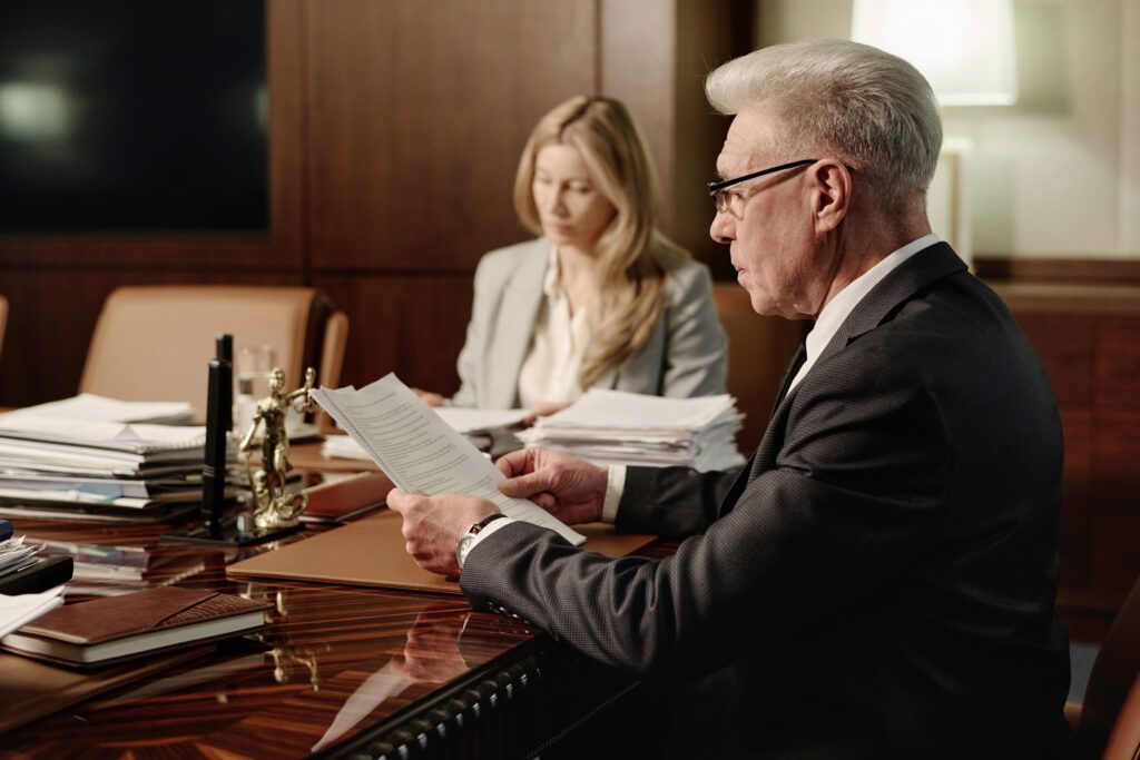 Criminal defence lawyers reviewing impaired driving case documents under Canada’s DUI laws