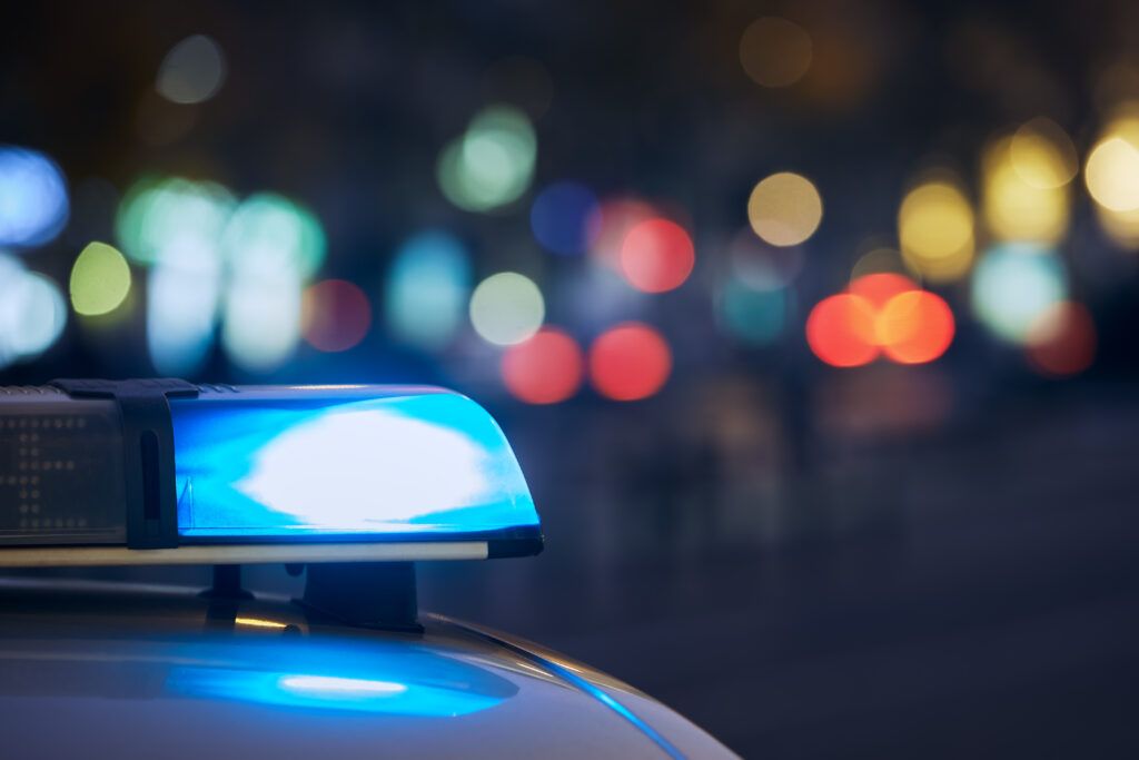 Blue police lights flashing during a roadside stop related to a breathalyzer demand under Canadian impaired driving law